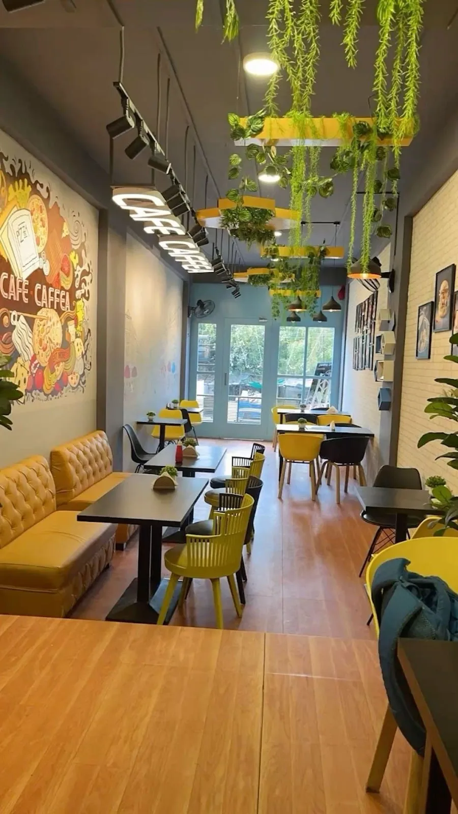 Bright cafe interior with greenery